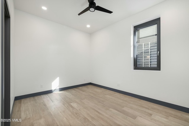 spare room with a ceiling fan, recessed lighting, baseboards, and wood finished floors