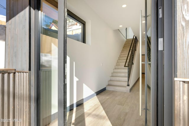 interior space with wood finished floors and recessed lighting