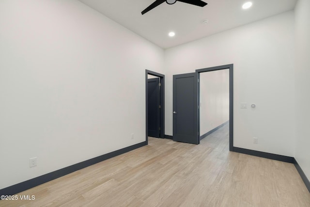 unfurnished room with light wood-type flooring, ceiling fan, baseboards, and recessed lighting