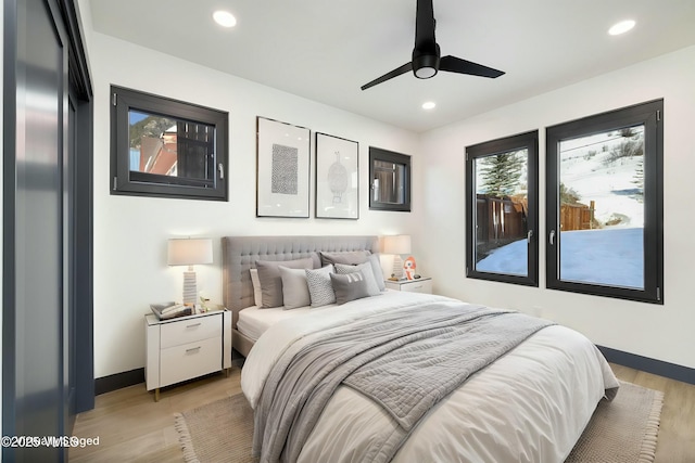 bedroom featuring light wood-style flooring, baseboards, and recessed lighting