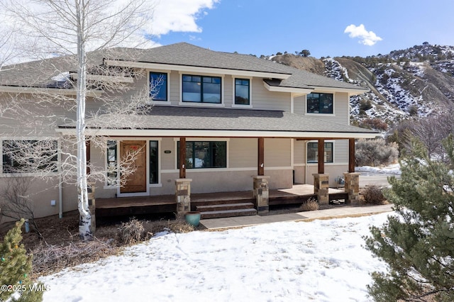 view of front of house with a mountain view and covered porch