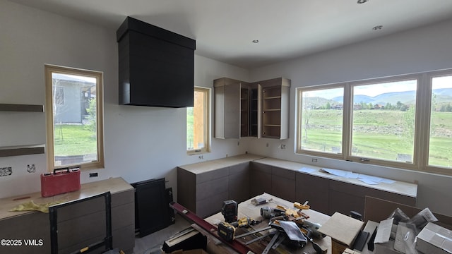 213 Harvester Ct, Eagle, CO 81631 - kitchen with light countertops, healthy amount of natural light, modern cabinets, and dark cabinetry
