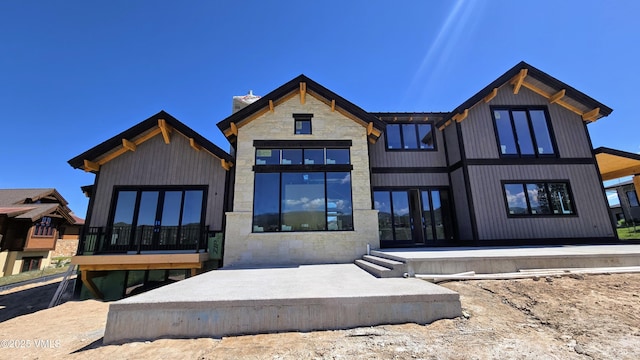 213 Harvester Ct, Eagle, CO 81631 - rear view of property featuring stone siding