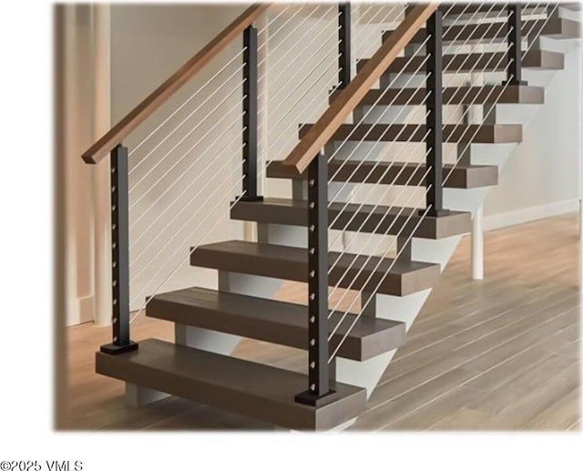 213 Harvester Ct, Eagle, CO 81631 - staircase with wood finished floors and baseboards