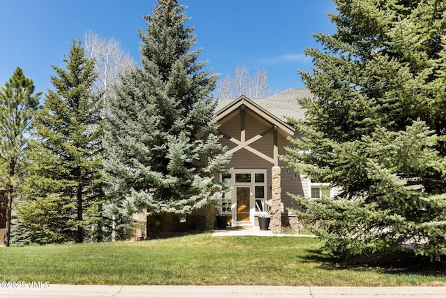 85 Remington Trl, Edwards, CO 81632 - view of property hidden behind natural elements with a front yard and stone siding