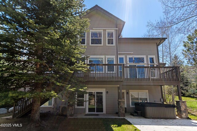 85 Remington Trl, Edwards, CO 81632 - rear view of property featuring a hot tub, a patio, and a wooden deck