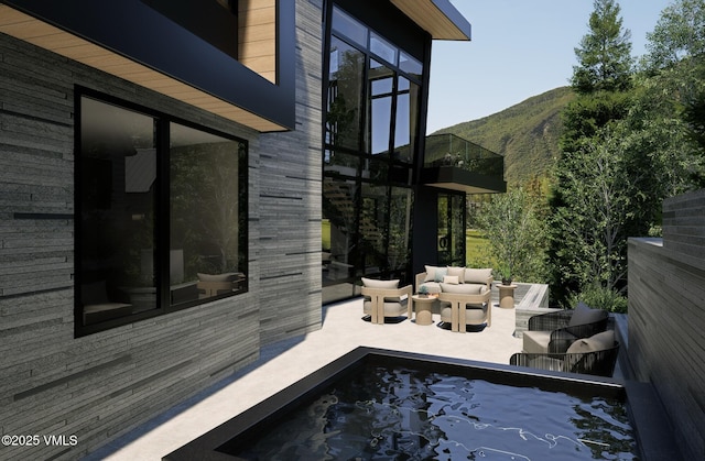 1150 Ptarmigan Rd, Vail, CO 81657 - view of swimming pool featuring an outdoor living space, a mountain view, and a patio area