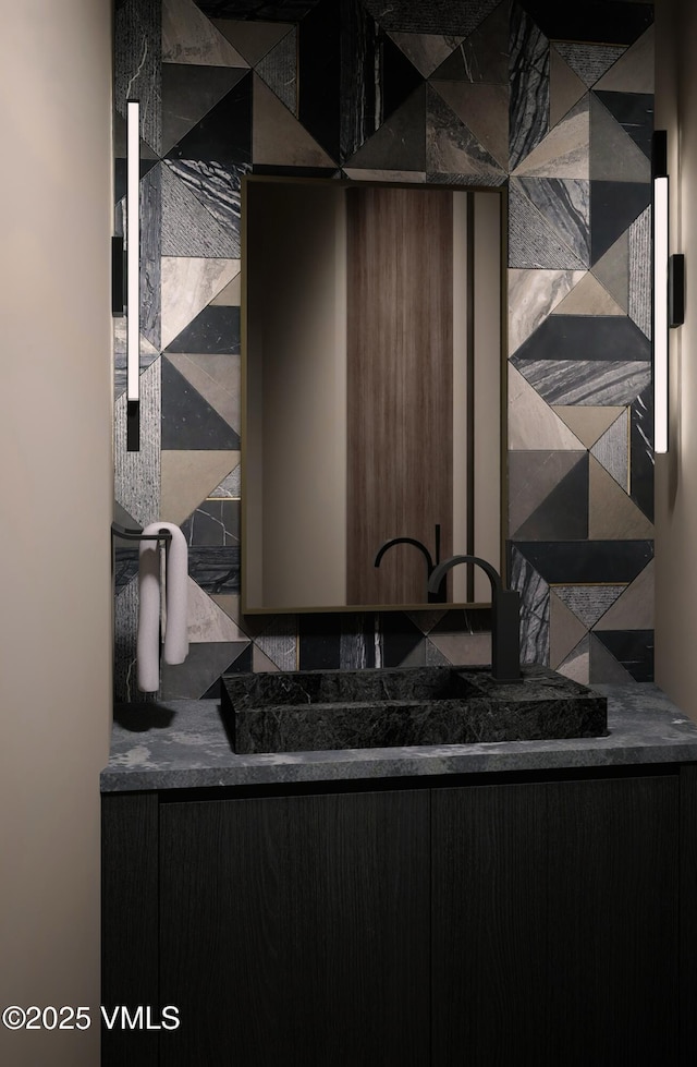 1150 Ptarmigan Rd, Vail, CO 81657 - bathroom featuring vanity and tasteful backsplash