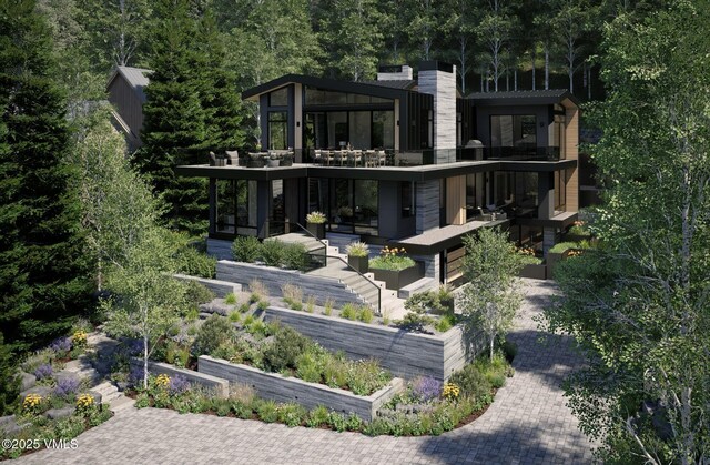 1150 Ptarmigan Rd, Vail, CO 81657 - rear view of property featuring a balcony and a vegetable garden