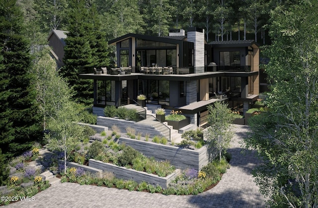 1150 Ptarmigan Rd, Vail, CO 81657 - rear view of property featuring a balcony and a vegetable garden