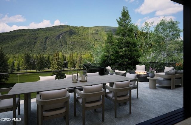 1150 Ptarmigan Rd, Vail, CO 81657 - view of patio / terrace with a fire pit, outdoor dining space, and a mountain view