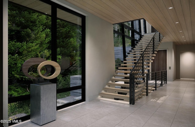 1150 Ptarmigan Rd, Vail, CO 81657 - staircase featuring tile patterned flooring, recessed lighting, wooden ceiling, and expansive windows