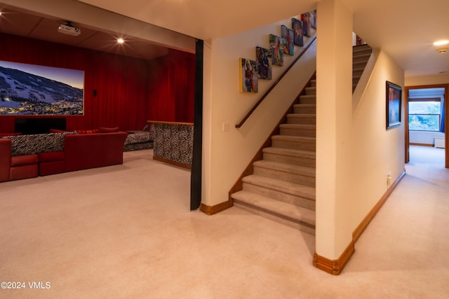 stairs with beam ceiling and carpet floors