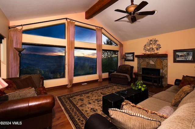 living room featuring ceiling fan, vaulted ceiling with beams, a fireplace, and dark hardwood / wood-style floors