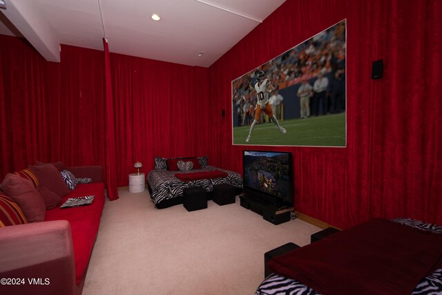 bedroom with carpet floors and wooden walls