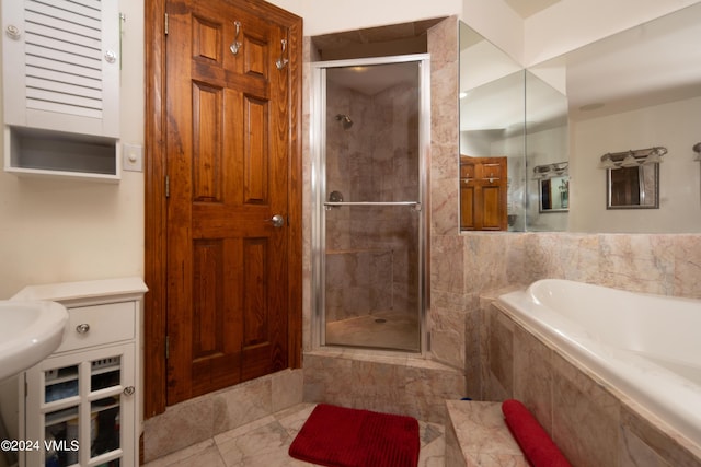 bathroom featuring separate shower and tub