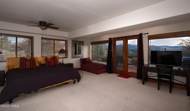 bedroom with light colored carpet and ceiling fan