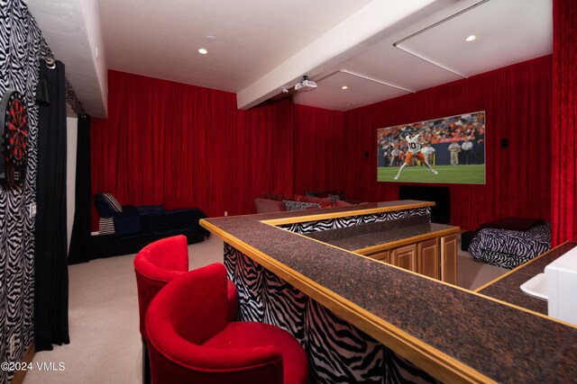 playroom with beamed ceiling, wooden walls, and carpet flooring