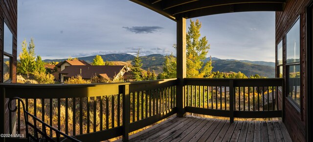 wooden terrace featuring a mountain view