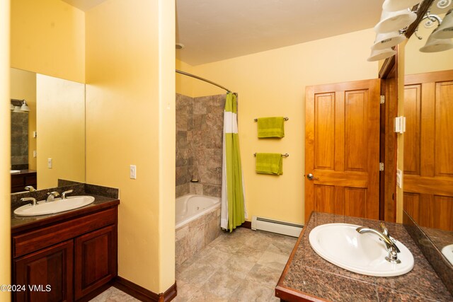 bathroom with a baseboard radiator, vanity, and shower / tub combo with curtain