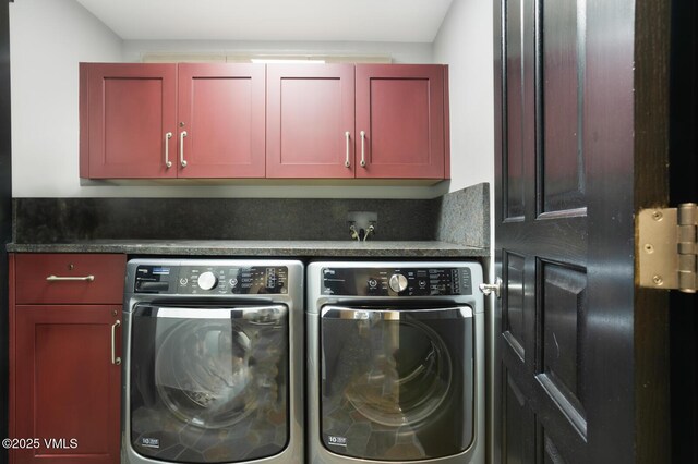 clothes washing area with cabinet space and washing machine and dryer