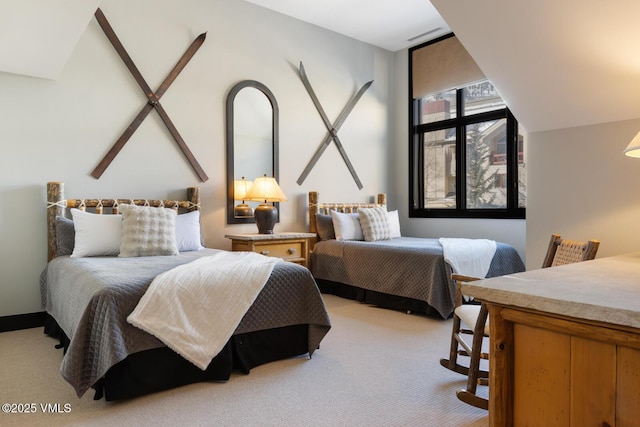 bedroom featuring light colored carpet