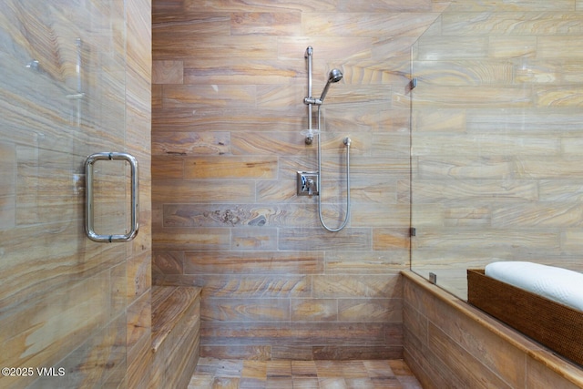 full bathroom with tiled shower