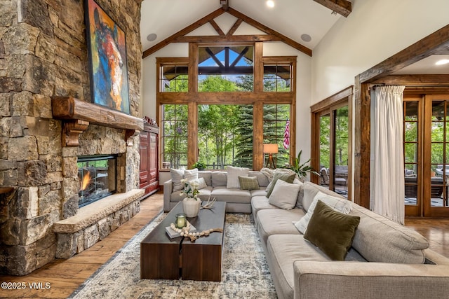 922 June Creek Rd, Edwards, CO 81632 - living area with high vaulted ceiling, wood-type flooring, plenty of natural light, a fireplace, and beam ceiling