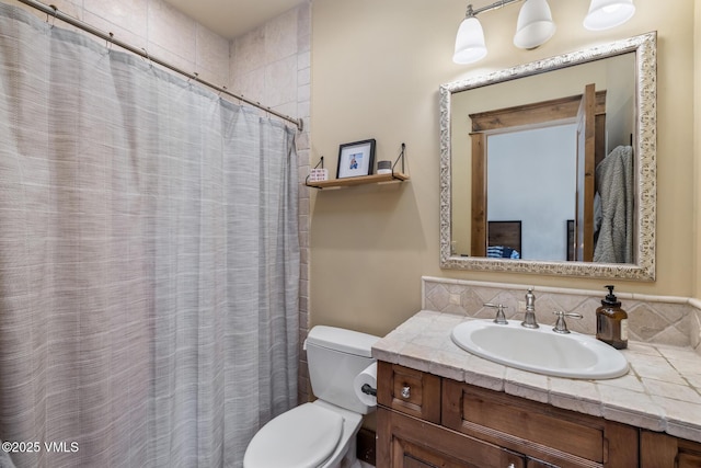 922 June Creek Rd, Edwards, CO 81632 - bathroom with toilet, vanity, and curtained shower