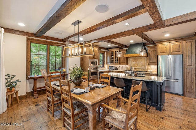 922 June Creek Rd, Edwards, CO 81632 - dining room featuring light wood finished floors, baseboards, beam ceiling, and recessed lighting
