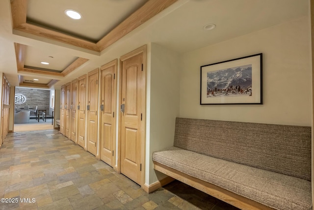600 Vail Valley Dr Unit 310, Vail, CO 81657 - hallway featuring light stone finish floors, a raised ceiling, and recessed lighting