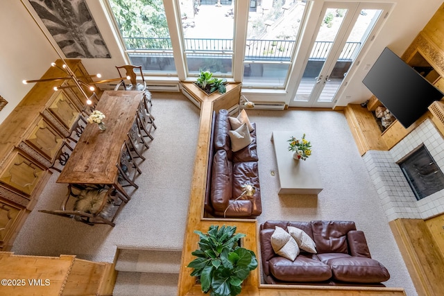 600 Vail Valley Dr Unit 310, Vail, CO 81657 - living room with carpet flooring, french doors, and a fireplace