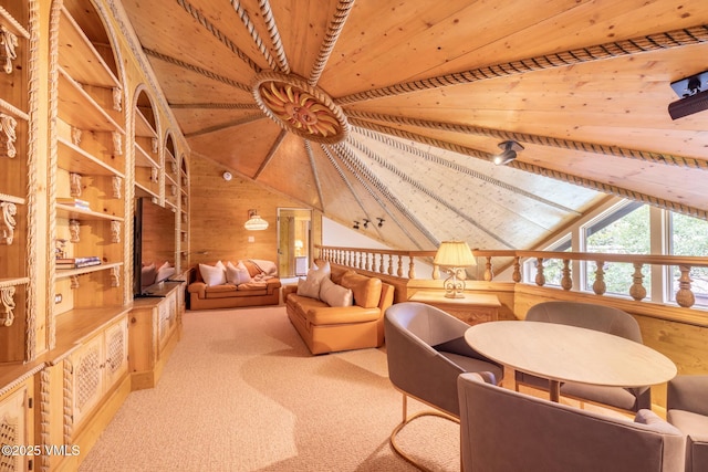 600 Vail Valley Dr Unit 310, Vail, CO 81657 - sitting room featuring wooden ceiling, wooden walls, and carpet