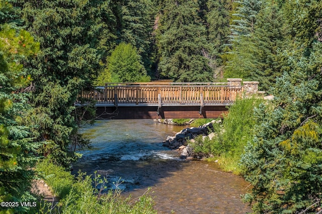 600 Vail Valley Dr Unit 310, Vail, CO 81657 - exterior space featuring a wooden deck and a forest view
