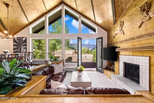 600 Vail Valley Dr Unit 310, Vail, CO 81657 - living room with high vaulted ceiling, a fireplace, and a wood ceiling with exposed beams