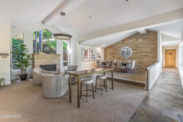 600 Vail Valley Dr Unit 310, Vail, CO 81657 - living room with a stone fireplace and stone tile flooring