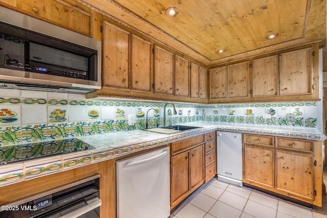 600 Vail Valley Dr Unit 310, Vail, CO 81657 - kitchen with dishwashing machine, stainless steel microwave, brown cabinetry, wood ceiling, and recessed lighting