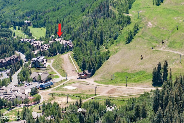600 Vail Valley Dr Unit 310, Vail, CO 81657 - aerial view of property and surrounding area featuring a heavily wooded area