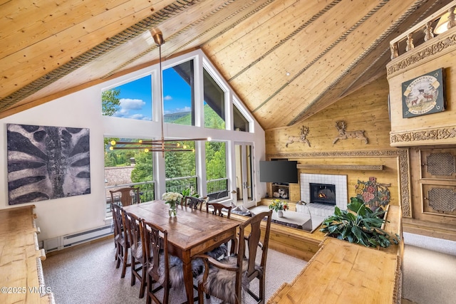 600 Vail Valley Dr Unit 310, Vail, CO 81657 - carpeted dining space featuring a baseboard heating unit, high vaulted ceiling, a fireplace, a wooden ceiling with exposed beams, and wooden walls