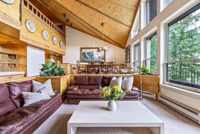 600 Vail Valley Dr Unit 310, Vail, CO 81657 - living area with carpet flooring, high vaulted ceiling, wooden ceiling, healthy amount of natural light, and a chandelier