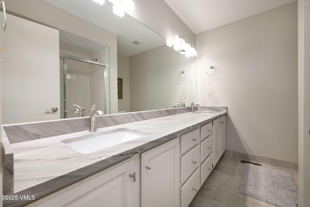 4515 Bighorn Rd, Vail, CO 81657 - full bath with double vanity, a shower stall, tile patterned floors, and baseboards