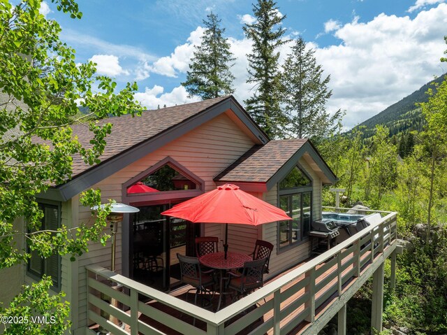 4515 Bighorn Rd, Vail, CO 81657 - wooden terrace with a forest view