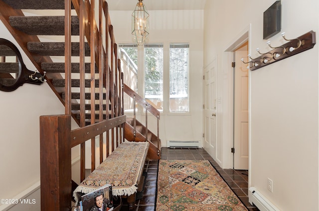 interior space featuring baseboard heating and dark tile patterned floors