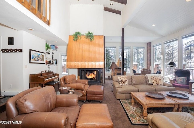 carpeted living room featuring a baseboard heating unit, beam ceiling, and high vaulted ceiling