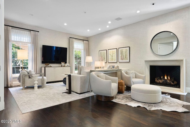 450 Steele St, Denver, CO 80236 - living area featuring wood finished floors, recessed lighting, and a warm lit fireplace