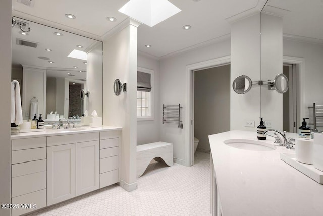 450 Steele St, Denver, CO 80236 - full bath with ornamental molding, a skylight, vanity, recessed lighting, and tile patterned floors