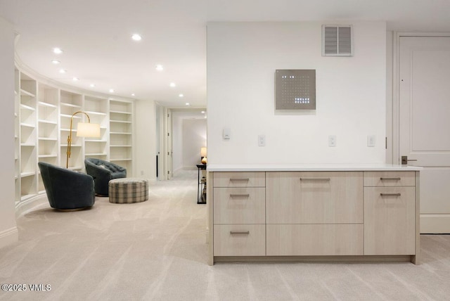 450 Steele St, Denver, CO 80236 - kitchen featuring light brown cabinetry, modern cabinets, light carpet, recessed lighting, and open floor plan