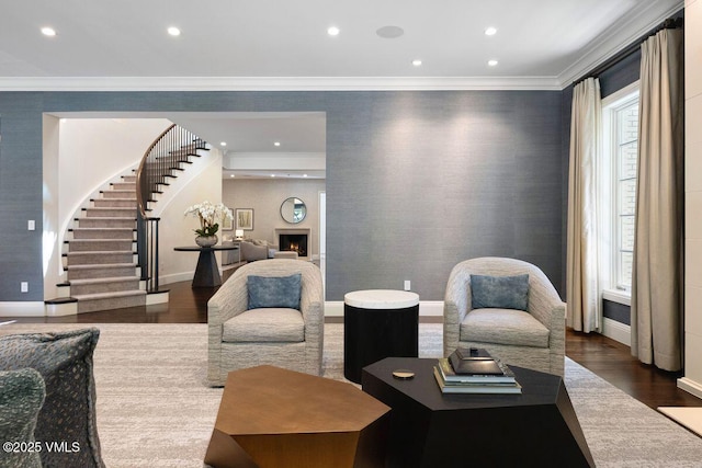 450 Steele St, Denver, CO 80236 - living area with wood finished floors, recessed lighting, stairway, crown molding, and a warm lit fireplace