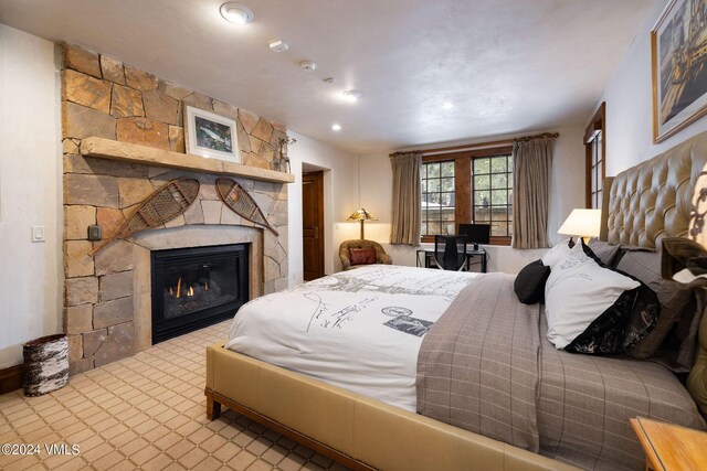 bedroom featuring a fireplace