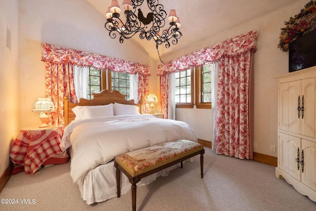 carpeted bedroom featuring an inviting chandelier and vaulted ceiling